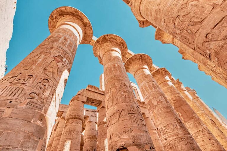 Hypostyle Hall with huge columns in Karnak temple in the famous city of Luxor. Travel attractions and heritage in Egypt