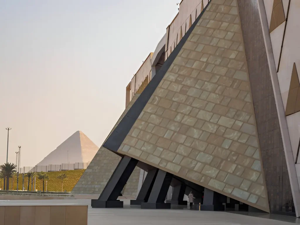 The main entrance to the Grand Egyptian Museum with the Great Pyramid of Giza in the background in Giza