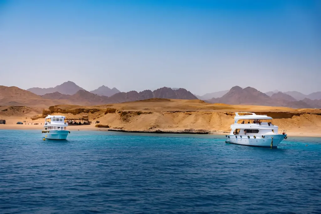 Touristic dive boats near Ras Mohammed coral reef on Sinai Peninsula in Egypt.