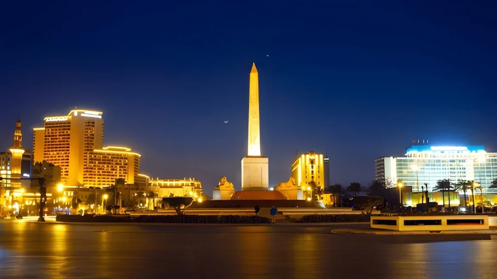 Famous Ramses II obelisk and Tahrir Square with traffic , evening view, Cairo, Egypt