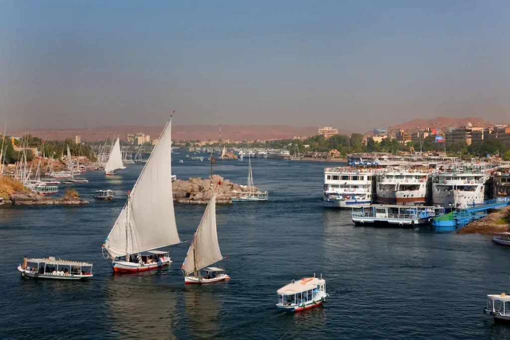 view from Ferial Garden to Nile with feluccas and river cruise ships, Egypt, Assuan