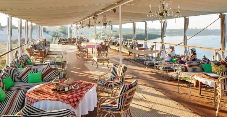 Dahabiya sun deck with comfortable seating and panoramic Nile views