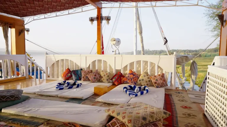 Colorful cushioned relaxation area on the Amoura Dahabiya sun deck